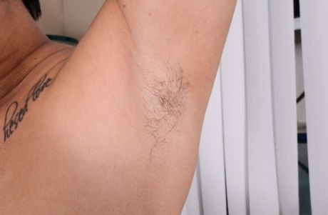 Asian babe Lulu Sparkle strips naked & spreads her hairy pussy up close
